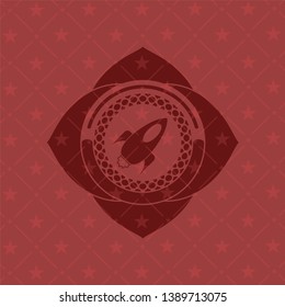 rocket icon inside realistic red emblem