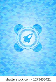 rocket icon inside realistic sky blue emblem. Mosaic background