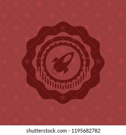 rocket icon inside red icon or emblem