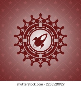 rocket icon inside red emblem. 