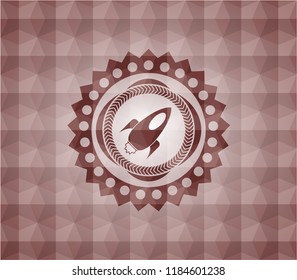 rocket icon inside red seamless emblem or badge with abstract geometric pattern background.