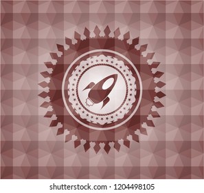 rocket icon inside red seamless geometric emblem.