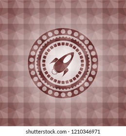 rocket icon inside red seamless polygonal badge.
