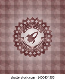 rocket icon inside red seamless geometric emblem.