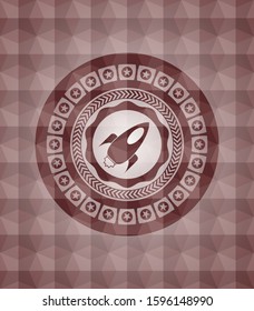 rocket icon inside red seamless emblem with geometric background.