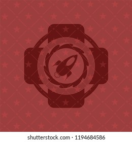 rocket icon inside retro style red emblem