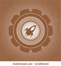 rocket icon inside retro style wood emblem