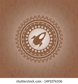 rocket icon inside retro wood emblem