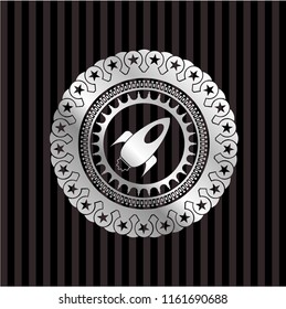 rocket icon inside silver badge