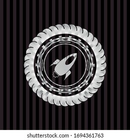 rocket icon inside silver shiny badge
