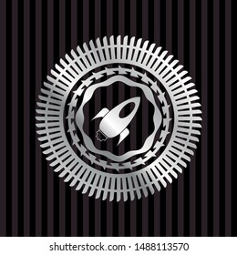 rocket icon inside silvery badge