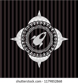 rocket icon inside silvery shiny emblem