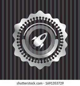Icono del cohete dentro de una insignia silenciosamente brillante