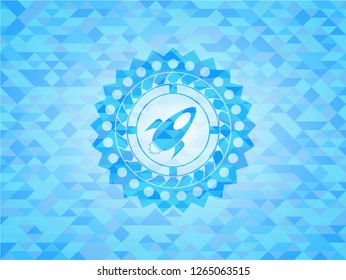 rocket icon inside sky blue emblem with triangle mosaic background