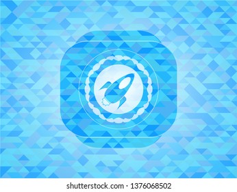 rocket icon inside sky blue emblem with triangle mosaic background
