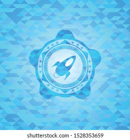 rocket icon inside sky blue emblem with mosaic ecological style background