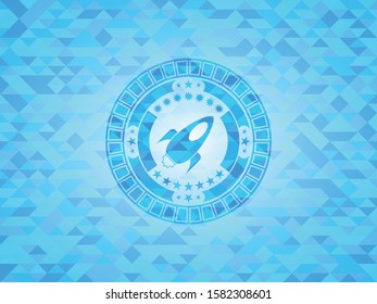 rocket icon inside sky blue emblem with mosaic background