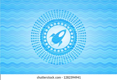 rocket icon inside water wave representation style emblem.