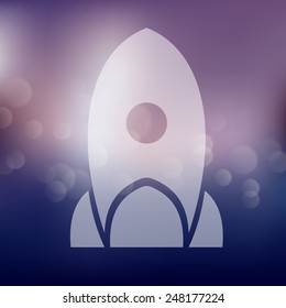 rocket icon on blurred background