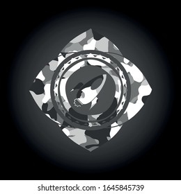 rocket icon on grey camo pattern