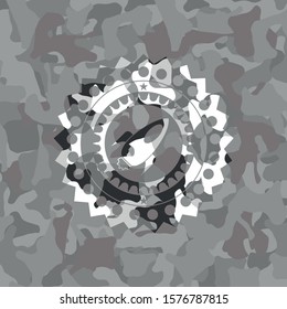 rocket icon on grey camouflage pattern