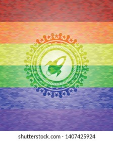 rocket icon on mosaic background with the colors of the LGBT flag