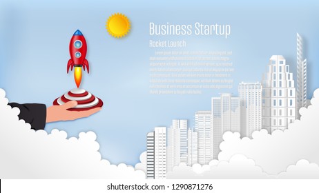 Rocket launch with building on the clouds and blue sky as paper art, craft style and business Startup project concept. flat design vector illustration.
