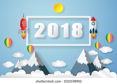 Rocket launch flying to the blue sky, clouds, colorful balloons and 2018 text as paper art, craft style and business new year start up concept. vector illustration.