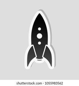 rocket launch icon. Sticker style with white border and simple shadow on gray background