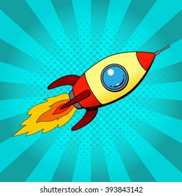 Rocket in retro pop art style. Space rocket  in pop art style on a blue background. Vector illustration. 