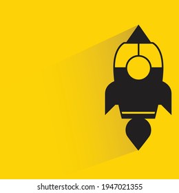 rocket with shadow on yellow background