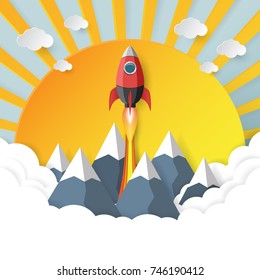 Rocket ship launch icon paper art style with clouds,mountains and sunshine background.Start up business concept design.Vector illustration.
