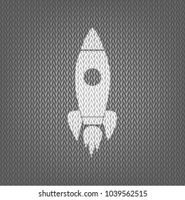 Rocket sign illustration. Vector. White knitted icon on gray knitted background. Isolated.
