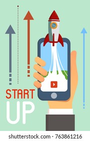 Rocket Start up Business flying from smartphone in hand with play button, steam and arrows on background. Flat vector design illustration.