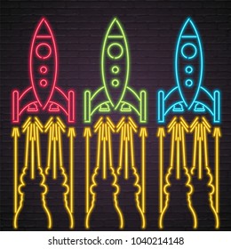 Rocket Symbol Sets Neon Light glowing Vector Illustration Different Colour Rocket Silhouette with Dark Background