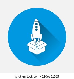 Rocket vector icon flying out of the box icon on blue background. Flat image with long shadow.