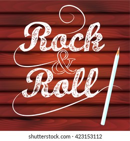 Rock-n-roll lettering, white pencil on wood texture