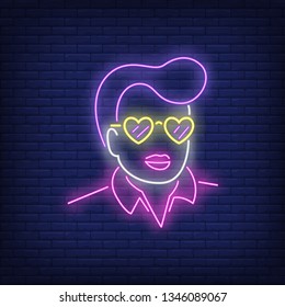 Rock-n-roll singer neon sign. Glowing neon man face in rock-n-roll retro style on brick wall background. Vector illustration can be used for topics like night club, dance studio, disco