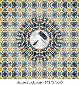 roller brush icon inside arabesque badge background. arabic decoration.