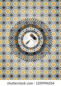 roller brush icon inside arabic badge background. Arabesque decoration.