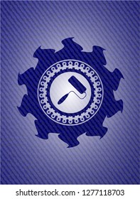 roller brush icon inside badge with denim background