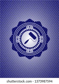 roller brush icon inside badge with denim texture
