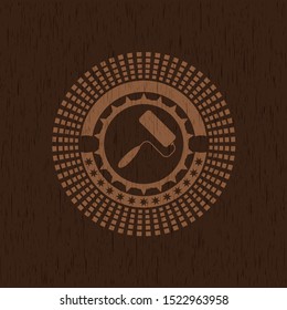 roller brush icon inside badge with wooden background