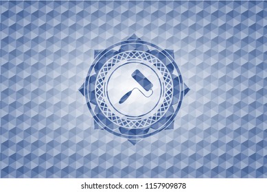 roller brush icon inside blue polygonal badge.