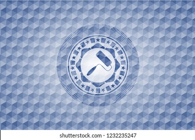 roller brush icon inside blue emblem with geometric pattern.