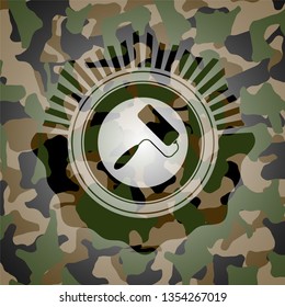 roller brush icon inside camo emblem