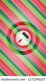 roller brush icon inside christmas emblem.