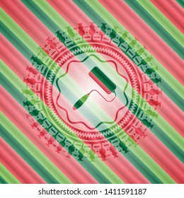 roller brush icon inside christmas badge.