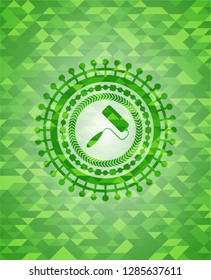 roller brush icon inside green emblem with mosaic ecological style background