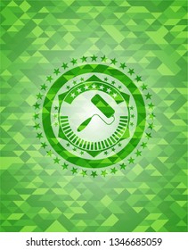 roller brush icon inside green emblem with mosaic background